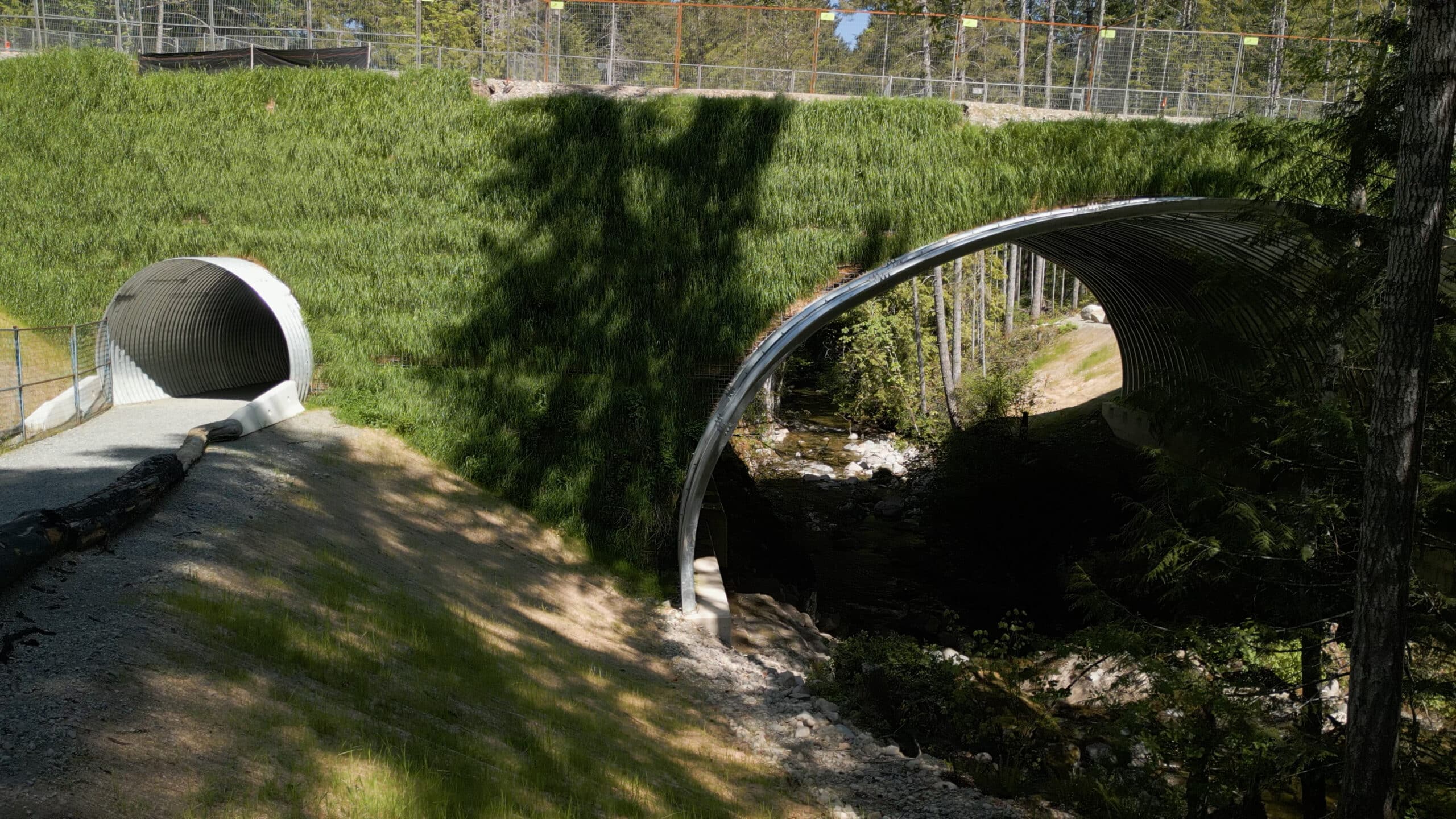 Wide view of stream crossing with greened in headwall