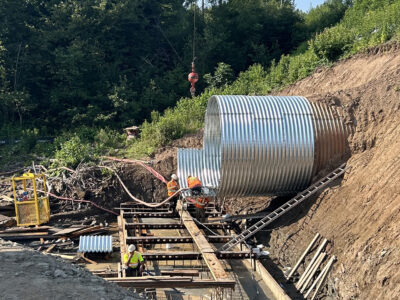 Wide view of Bolt-A-Plate culvert extension install